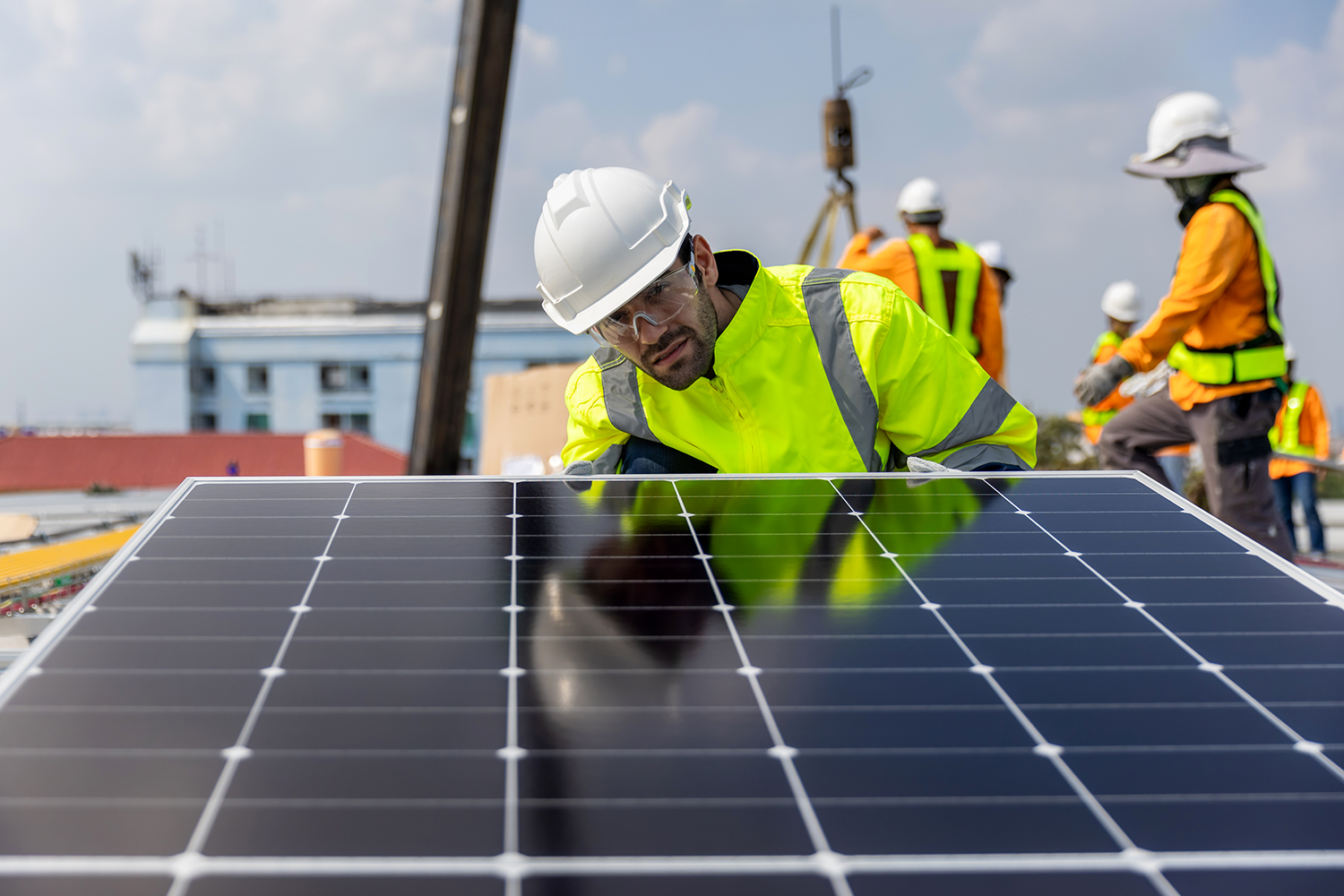 Workers installing solar panels